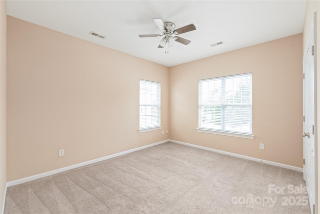 14104 Kendrick Cross Rd, Charlotte, NC 28273 - unfurnished room featuring light colored carpet, baseboards, and a ceiling fan