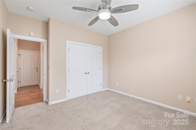 14104 Kendrick Cross Rd, Charlotte, NC 28273 - unfurnished bedroom with light colored carpet, baseboards, a closet, and ceiling fan