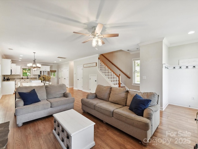 3801 Creek Ridge Dr, Denver, NC 28037 - living room with ornamental molding, stairway, ceiling fan, light wood finished floors, and recessed lighting