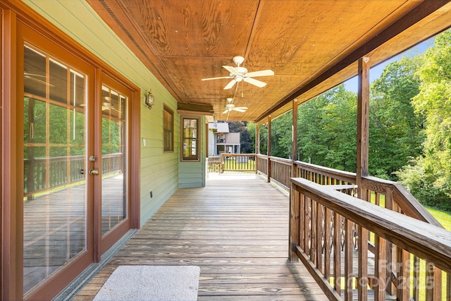wooden terrace with ceiling fan and french doors