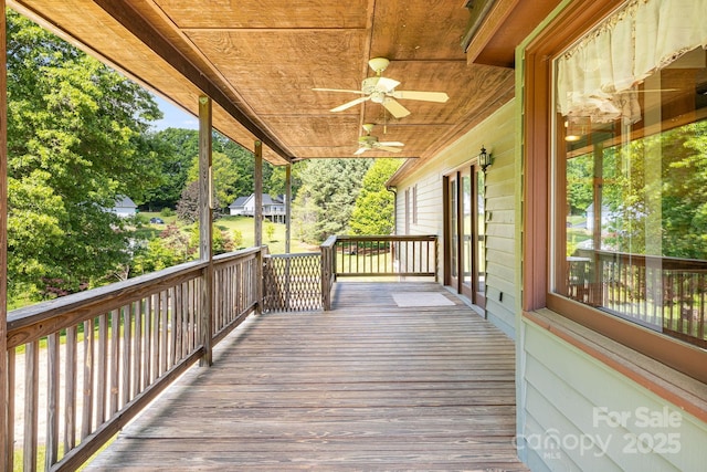 wooden terrace with a ceiling fan