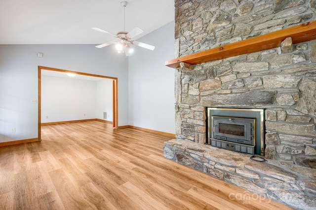 unfurnished living room featuring wood finished floors, baseboards, vaulted ceiling, and a ceiling fan