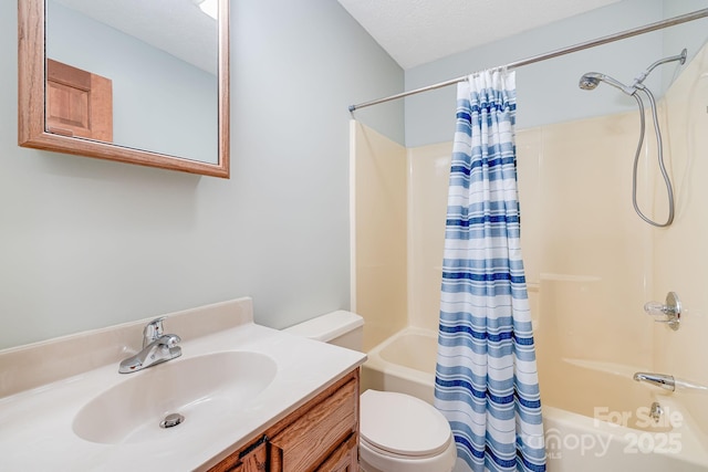 bathroom featuring shower / tub combo, toilet, and vanity