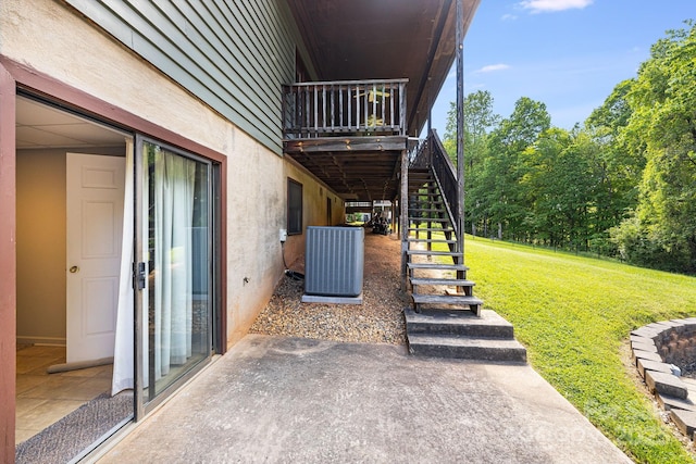 view of patio with stairway and central AC unit