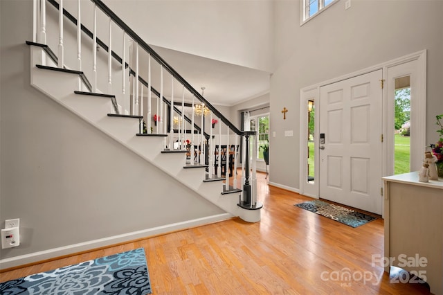 144 Chickasaw Dr, Shelby, NC 28152 - entryway with wood finished floors, baseboards, stairway, and a towering ceiling