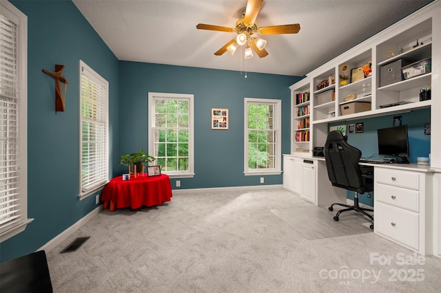 144 Chickasaw Dr, Shelby, NC 28152 - carpeted home office with a ceiling fan, a textured ceiling, baseboards, and built in desk