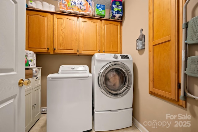 144 Chickasaw Dr, Shelby, NC 28152 - laundry area with cabinet space, washing machine and dryer, light tile patterned floors, and baseboards