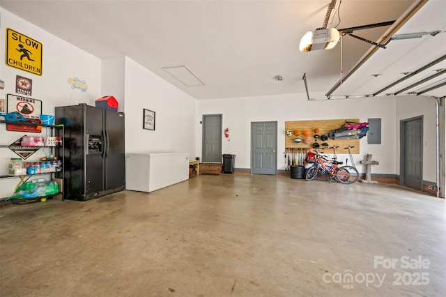 144 Chickasaw Dr, Shelby, NC 28152 - garage with black refrigerator with ice dispenser, a garage door opener, electric panel, and refrigerator