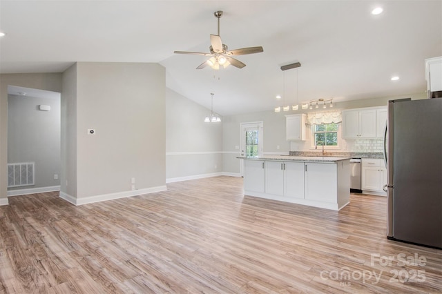 154 Stable Brook Ln, Taylorsville, NC 28681 - kitchen with stainless steel appliances, a kitchen island, a ceiling fan, light wood-style flooring, and recessed lighting