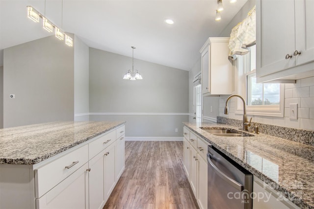154 Stable Brook Ln, Taylorsville, NC 28681 - kitchen with dishwasher, a sink, lofted ceiling, light wood-style floors, and backsplash