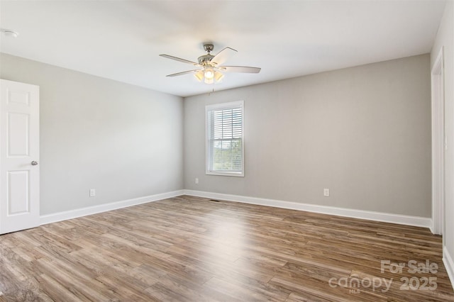 154 Stable Brook Ln, Taylorsville, NC 28681 - empty room featuring ceiling fan, wood finished floors, and baseboards