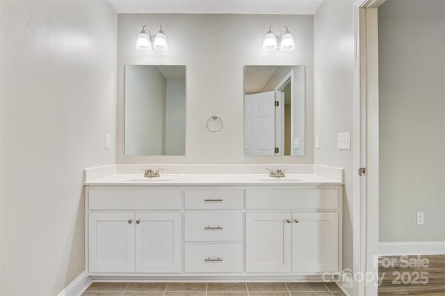 154 Stable Brook Ln, Taylorsville, NC 28681 - bathroom featuring baseboards and double vanity