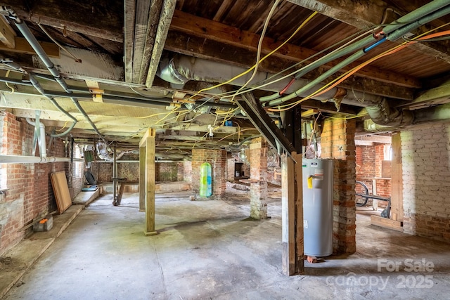 below grade area with gas water heater and brick wall