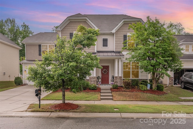 12832 Heath Grove Dr, Huntersville, NC 28078 - view of front of home featuring concrete driveway, a standing seam roof, and stone siding