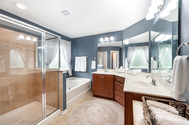 12832 Heath Grove Dr, Huntersville, NC 28078 - bathroom featuring a garden tub, double vanity, a shower stall, and tile patterned flooring