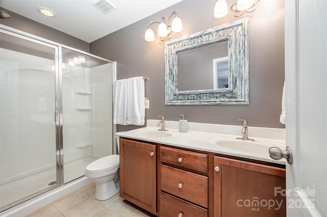 12832 Heath Grove Dr, Huntersville, NC 28078 - bathroom featuring a stall shower, double vanity, tile patterned floors, and toilet