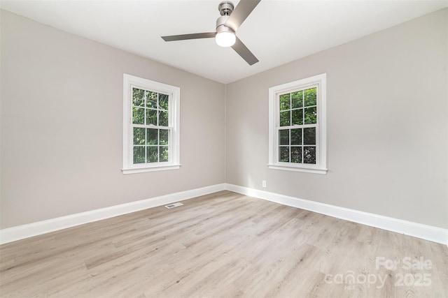 3920 Admiral Ave, Charlotte, NC 28205 - unfurnished room with healthy amount of natural light, light wood finished floors, ceiling fan, and baseboards