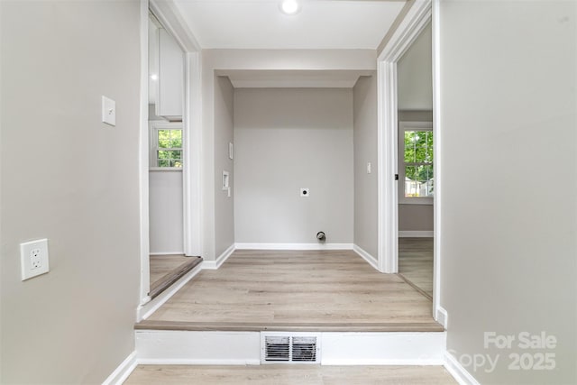 3920 Admiral Ave, Charlotte, NC 28205 - laundry area with electric dryer hookup, wood finished floors, and baseboards