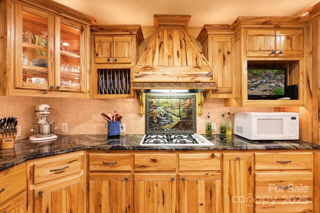 751 Millers Pond Ln, Boone, NC 28607 - kitchen featuring white appliances, custom range hood, backsplash, dark stone countertops, and glass insert cabinets