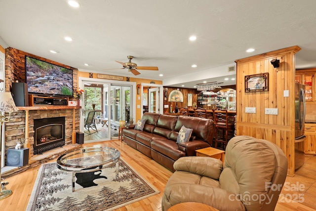 751 Millers Pond Ln, Boone, NC 28607 - living room with a ceiling fan, a stone fireplace, recessed lighting, wood finished floors, and wooden walls
