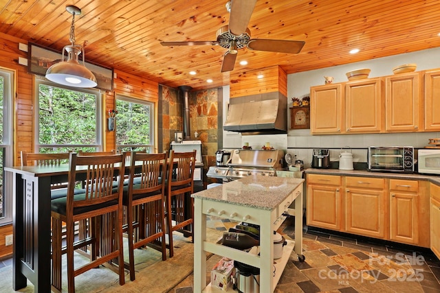 751 Millers Pond Ln, Boone, NC 28607 - kitchen featuring extractor fan, wooden ceiling, ceiling fan, a wood stove, and white microwave