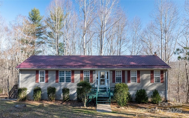 120 Powderhorn Dr, Burnsville, NC 28714 - manufactured / mobile home featuring metal roof, stairway, and a chimney
