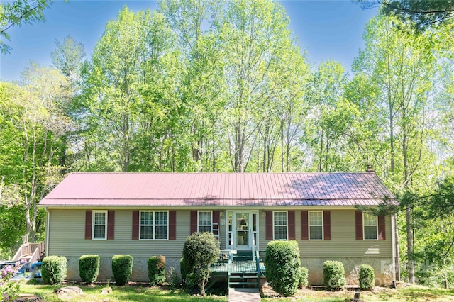 120 Powderhorn Dr, Burnsville, NC 28714 - view of front of property with metal roof, covered porch, a chimney, and a front yard