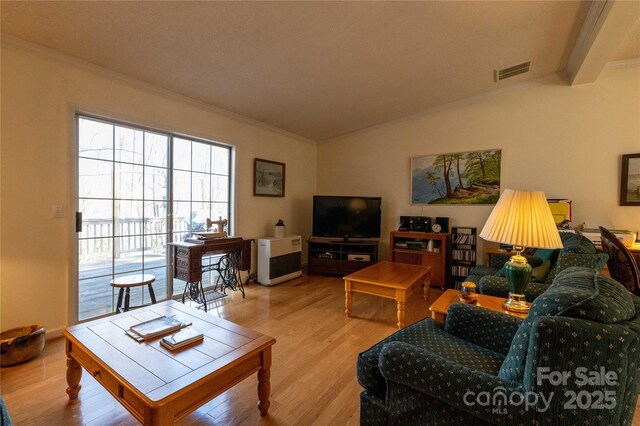 120 Powderhorn Dr, Burnsville, NC 28714 - living room with crown molding, wood finished floors, and vaulted ceiling