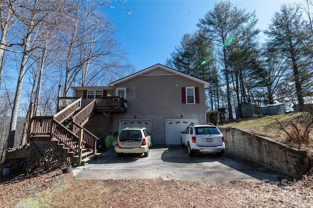 120 Powderhorn Dr, Burnsville, NC 28714 - back of house featuring asphalt driveway, stairs, a garage, and a deck