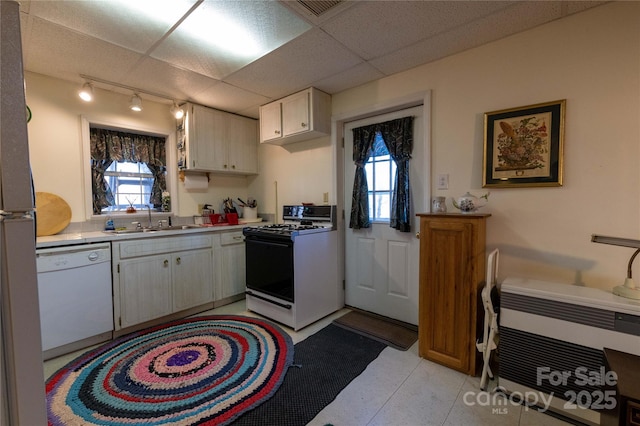 120 Powderhorn Dr, Burnsville, NC 28714 - kitchen featuring dishwasher, range with gas stovetop, a sink, track lighting, and light countertops