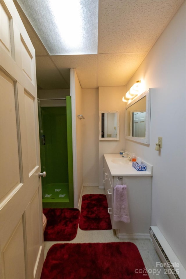 120 Powderhorn Dr, Burnsville, NC 28714 - bathroom with a stall shower, a baseboard radiator, vanity, and baseboards