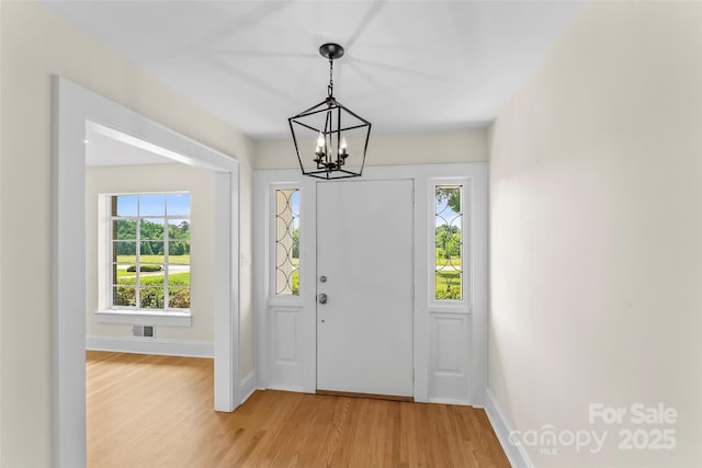 90 Pinewood Rd, Granite Falls, NC 28630 - foyer entrance featuring a chandelier, light wood-style flooring, and baseboards
