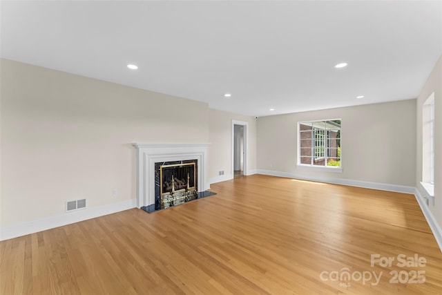 90 Pinewood Rd, Granite Falls, NC 28630 - unfurnished living room featuring light wood-style floors, a fireplace, baseboards, and recessed lighting