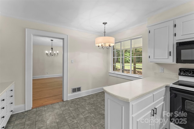 90 Pinewood Rd, Granite Falls, NC 28630 - kitchen featuring range with electric stovetop, a chandelier, black microwave, light countertops, and crown molding