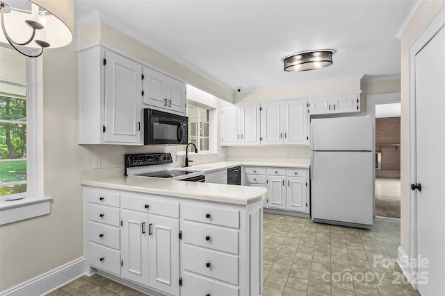 90 Pinewood Rd, Granite Falls, NC 28630 - kitchen with black appliances, baseboards, light countertops, ornamental molding, and a peninsula