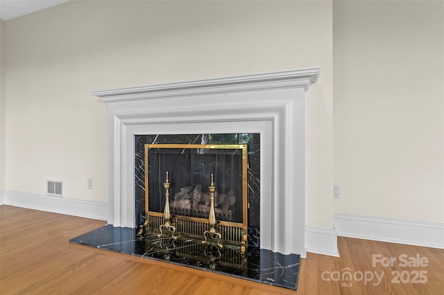90 Pinewood Rd, Granite Falls, NC 28630 - detailed view of wood finished floors, baseboards, and a high end fireplace