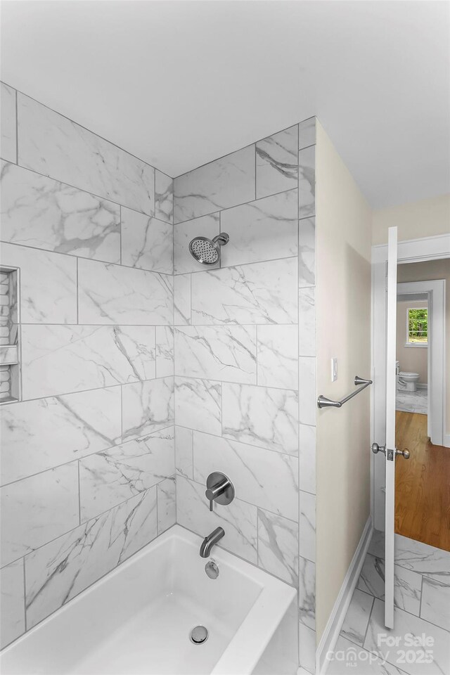 90 Pinewood Rd, Granite Falls, NC 28630 - full bath featuring shower / bathtub combination, marble finish floors, toilet, and baseboards