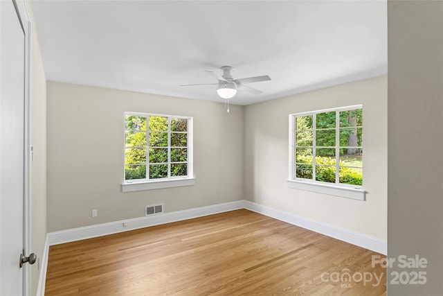 90 Pinewood Rd, Granite Falls, NC 28630 - empty room featuring light wood-style flooring, healthy amount of natural light, baseboards, and ceiling fan