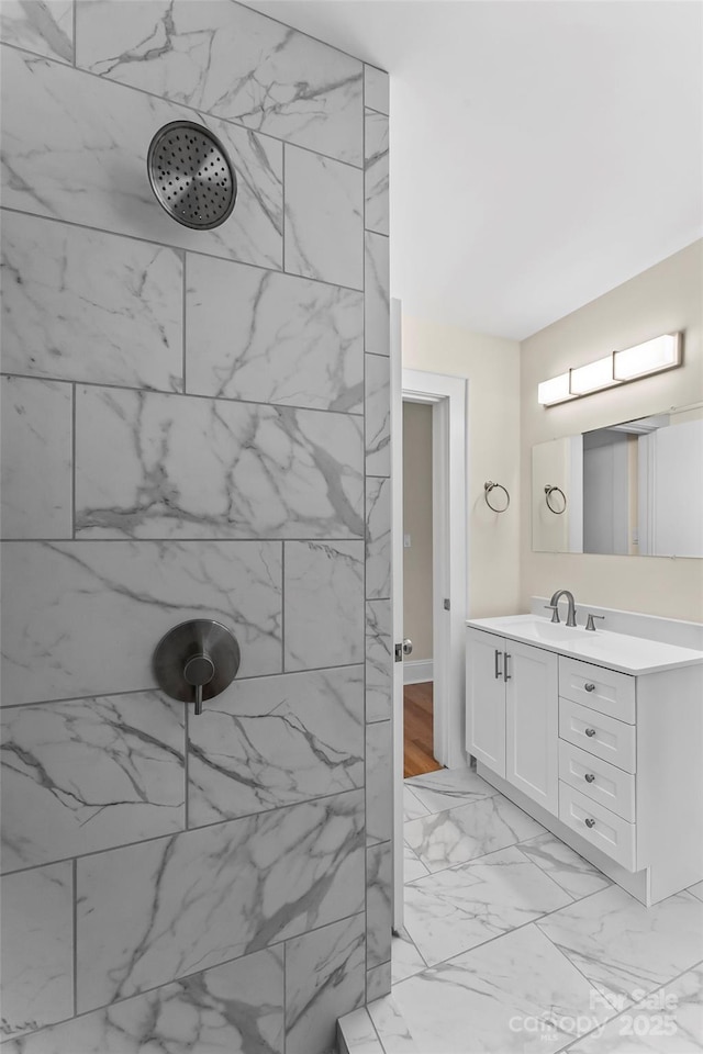 90 Pinewood Rd, Granite Falls, NC 28630 - bathroom featuring marble look tile flooring, tiled shower, and vanity