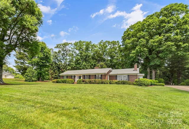 90 Pinewood Rd, Granite Falls, NC 28630 - ranch-style house featuring a chimney, a front lawn, and view of scattered trees