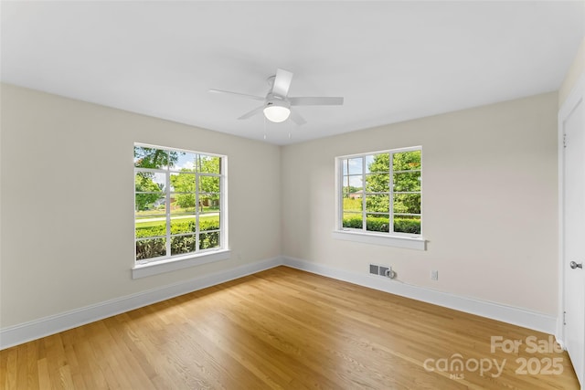 90 Pinewood Rd, Granite Falls, NC 28630 - spare room featuring healthy amount of natural light, baseboards, light wood-style flooring, and ceiling fan