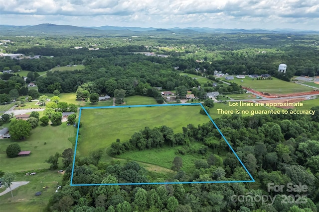 90 Pinewood Rd, Granite Falls, NC 28630 - view of property location with property parcel outlined, a heavily wooded area, and a mountainous background