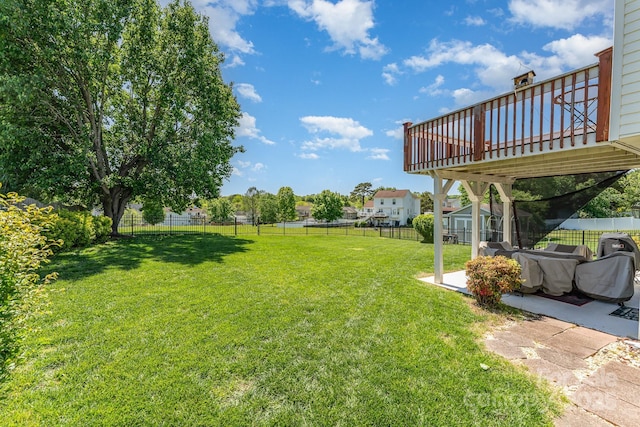 view of yard featuring a wooden deck and a patio area