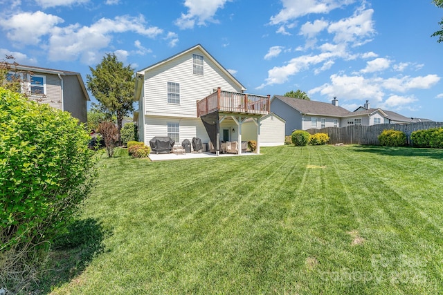 rear view of property with a patio area and a deck