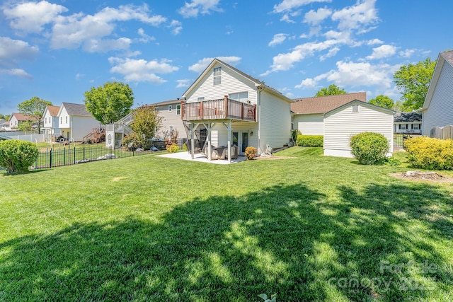 rear view of house with a patio, a deck, and a residential view