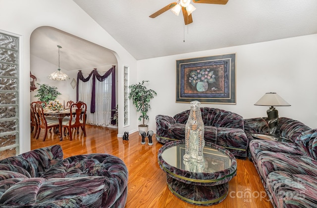 1076 Braxton Dr, Concord, NC 28025 - living area with ceiling fan, vaulted ceiling, and wood finished floors