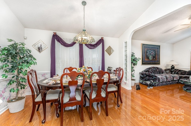 1076 Braxton Dr, Concord, NC 28025 - dining area with a chandelier, light wood finished floors, lofted ceiling, and a ceiling fan