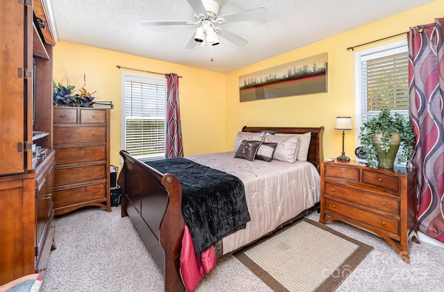 1076 Braxton Dr, Concord, NC 28025 - bedroom featuring light colored carpet, a textured ceiling, and ceiling fan