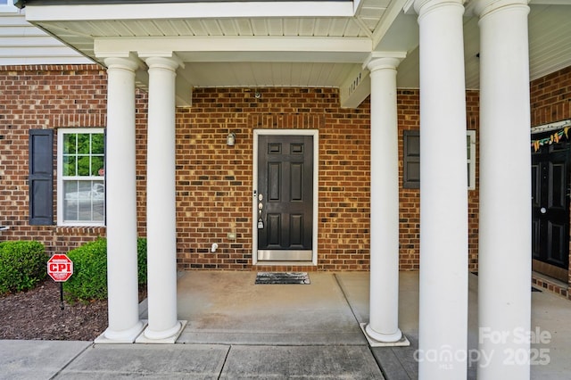 11209 Lazio Ln Unit 1, Charlotte, NC 28277 - property entrance with brick siding and covered porch
