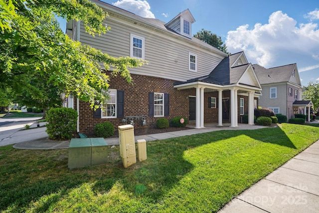 11209 Lazio Ln Unit 1, Charlotte, NC 28277 - greek revival inspired property with brick siding and a front lawn